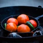 Tomato sauce simmering in a seasoned cast iron skillet pH comparison of tomato, wine, vinegar, and citrus for cast iron cooking