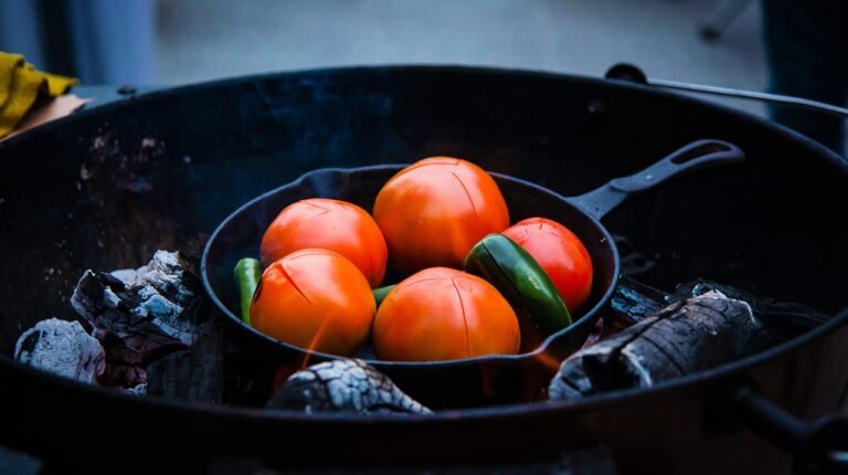 Tomato sauce simmering in a seasoned cast iron skillet pH comparison of tomato, wine, vinegar, and citrus for cast iron cooking