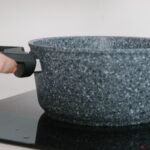 Cast iron skillet heating on an induction cooktop