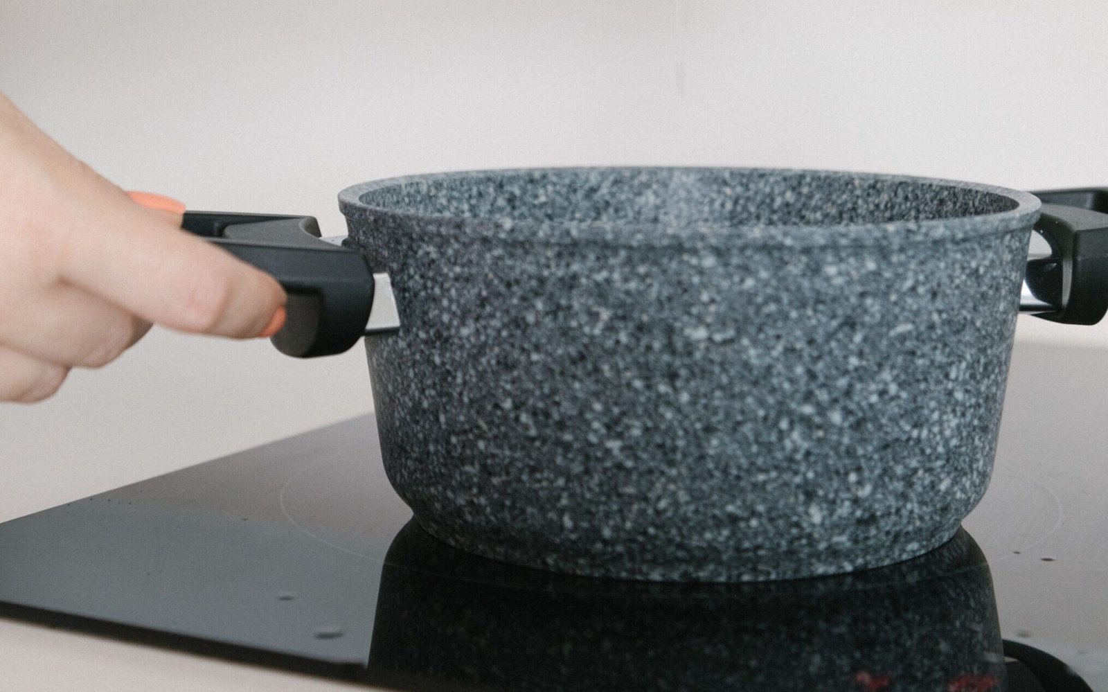 Cast iron skillet heating on an induction cooktop
